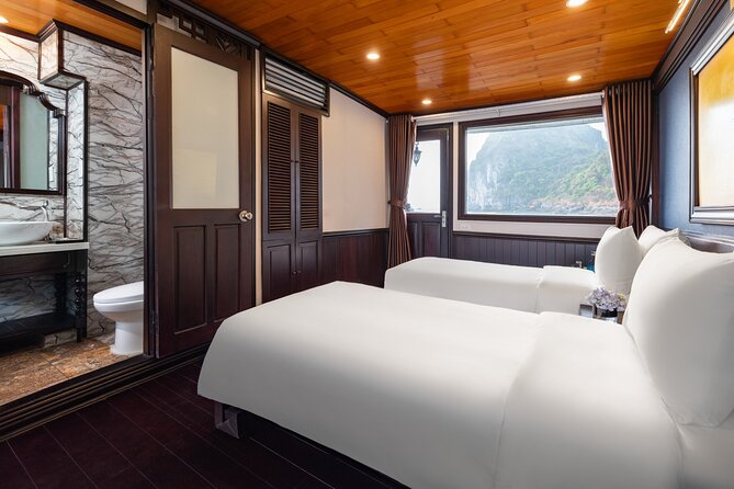 2-Day Boutique Cruise Discover Hidden Gems of Bai Tu Long Bay - Sunset, dinner, and an overnight cabin