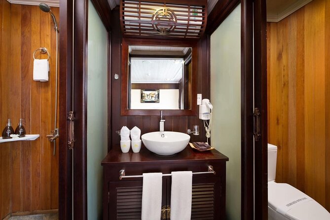 BOUTIQUE CRUISES Halong Bay 2 Days,1 Night Tour: Swimming,Caving, and Kayaking - Boarding Halong Bay and settling into your cabin