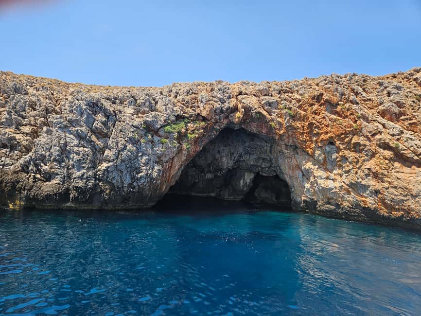 Chania:Souda Bay Cruise to Sea Caves & Beaches with pick up - Passing the islet of Souda at the gulf entrance