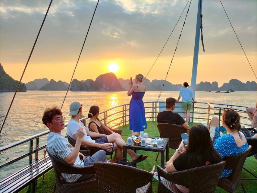 From Hanoi: Halong Bay Deluxe Cruise Day Trip - Titop Island, stairs, beach, and the bay from above