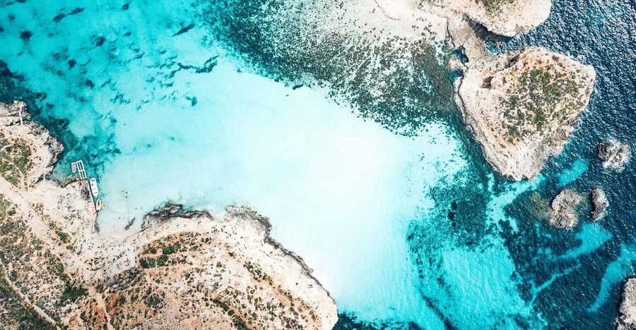 From Mellieha: Three Bay Cruise including the Blue Lagoon - Blue Lagoon: beautiful water, crowded shore