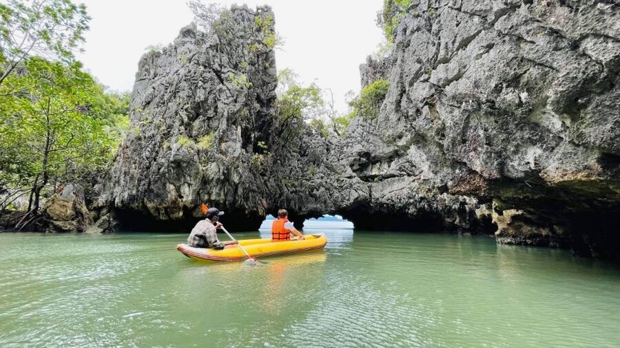 From Phuket: Phang Nga Bay and Canoeing Tour by Big Boat - Guides, Canoe Paddlers, and the Human Side