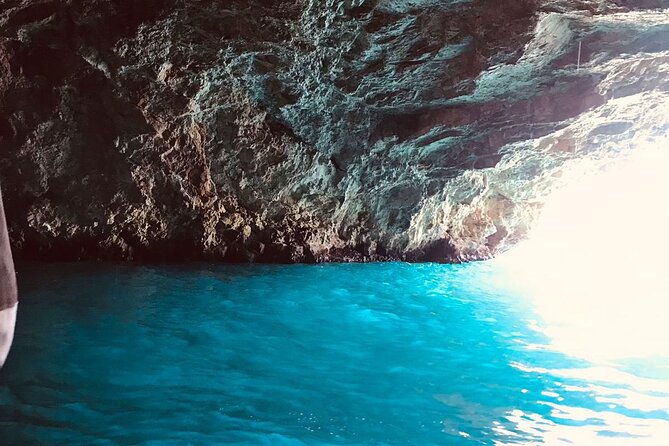 Group Guided Tour: Blue Cave Speedboat Tour in the Bay of Kotor - Perast appears as a storybook waterfront