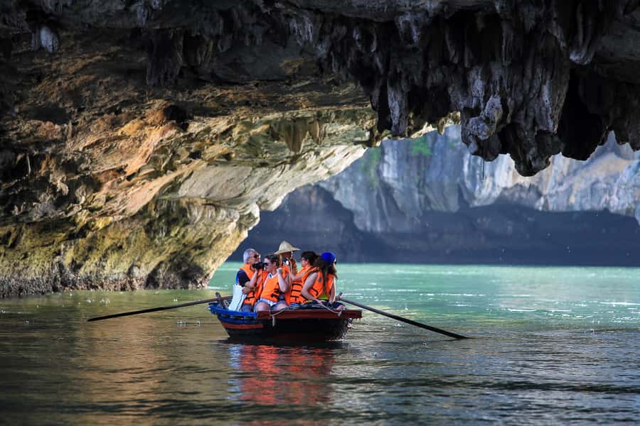 Halong Bay: Day Cruise with Caves, Kayaking & Sunset Party - Walking through the huge chambers of Sung Sot Cave