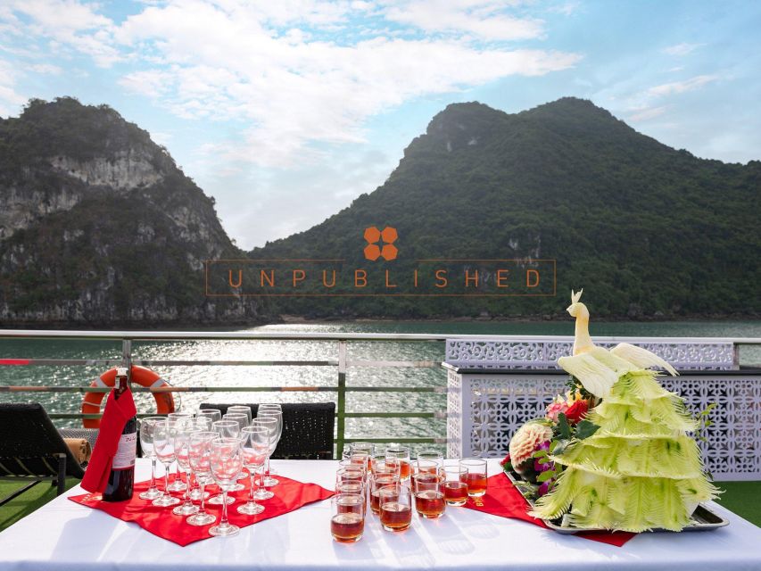 Halong Bay Delights: Deluxe Day Cruise with Kayaking & Lunch - Sunset tea, fruit, and the ride back