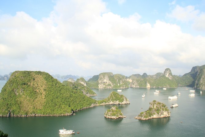 Halong bay full day trip: Visit Surprise cave, Titop island, kayaking & swimming - Cruising past Ha Long Bay’s limestone towers