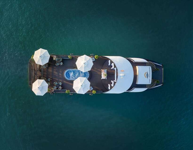 Halong Bay: Luxury Day Cruise with Buffet, Kayak, Swim - Boarding the boat and settling in over lunch