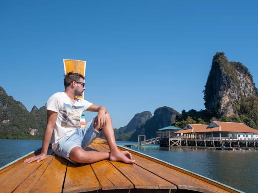 Krabi: James Bond Island Tour & Phang Nga by Longtail Boat - Riding a longtail boat into Phang Nga Bay