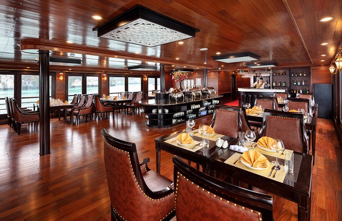 Luxury 4<em> Cruise 2Days 1night Ha Long Bay – V'spirit Premier Cruise – Key points to know before booking’ /></p>
<ul>
<li><strong>Lan Ha Bay instead of the main Ha Long route:</strong> You travel through the southern section of Ha Long Bay, known for a less-used route among similar limestone formations.</li>
<li><strong>Private balconies in every cabin:</strong> You have your own outdoor spot for bay views, sunset, and early morning air.</li>
<li><strong>Dark and Bright Cave by sampan:</strong> Local residents take you by small boat to two connected caverns and an enclosed lake.</li>
<li><strong>Tra Bau kayaking and a fishing farm visit:</strong> You paddle through the bay and learn about daily work on the water.</li>
<li><strong>Full-board meals and onboard activities:</strong> Breakfast, dinner, two lunches, tea, coffee, Tai Chi, cooking activities, and kayaking are included.</li>
<li><strong>A small group capped at 35 people:</strong> The cruise is not an intimate private charter, but it is more contained than a large sightseeing boat.</li>
</ul>
<h2>Why Lan Ha Bay is the right setting for a two-day cruise</h2>
<p> Cruise 2Days 1night Ha Long Bay – V'spirit Premier Cruise – Why Lan Ha Bay is the right setting for a two-day cruise’ /></p>
<p><p>The point of this trip is not to race from one sight to another. It is to spend time surrounded by limestone towers rising from the water, with your cabin as a quiet base between activities.</p>
</p>
<p><p>Lan Ha Bay is the southern section of the Ha Long Bay area. The scenery is closely related, with the same tall rock formations and water-level views, but this cruise follows a route described as less travelled. That matters if you want the atmosphere of a bay cruise without making every moment feel like a crowded photo stop.</p>
</p>
<p><p>V’Spirit Premier Cruise is built in a traditional Vietnamese style, with burnished wood, billowing sails, and oriental decoration across three decks. The design aims for a luxury feel rather than a simple transport boat. You can expect air conditioning, WiFi, a professional crew, and private balconies in the cabins.</p>
</p>
<p><p>The balcony is one of the most useful features here. It gives you a place to sit during the slow parts of the cruise, rather than requiring you to stay on the top deck. You can also step outside early in the morning or watch the sunset without leaving your room.</p>
</p>
<p><p>The price is $225 per person. That is not a bargain day trip, but it covers a great deal: Hanoi pickup and return, a luxury limousine bus, one night onboard, full-board meals, the guide, entrance fees, kayaking, insurance, service charges, and several scheduled activities. Drinks, tips, and personal spending are extra, so keep that in mind when working out your total cost.</p>
</p>
<div class="twil" style="margin: 20px 0; padding: 15px 0;"><p>More Luxury Cruises in Hanoi</p><ul style="margin: 10px 0; padding-left: 0; list-style: none;"><li style="margin: 0 0 12px 0; padding: 0 0 12px 0; border-bottom: 1px solid #DDEAE8; line-height: 1.4;"><a href="https://baycruisetrips.com/cozy-bay-halong-5-star-day-cruise-buffet-cave-kayak-swimming/">Cozy Bay Halong 5-Star Day Cruise, Buffet, Cave, Kayak, Swimming</a><br><span style="font-size: 0.82em; color: #555;"><span style="color: #0C6A5B;">★</span> 5.0 &nbsp;&middot;&nbsp; 3,512 reviews</span></li><li style="margin: 0 0 12px 0; padding: 0 0 12px 0; border-bottom: 1px solid #DDEAE8; line-height: 1.4;"><a href="https://baycruisetrips.com/hanoi-2-day-halong-lan-ha-bay-5-star-cruise-with-balcony/">Hanoi: 2-Day Halong & Lan Ha Bay 5-Star Cruise with Balcony</a><br><span style="font-size: 0.82em; color: #555;"><span style="color: #0C6A5B;">★</span> 4.8 &nbsp;&middot;&nbsp; 3,300 reviews</span></li><li style="margin: 0; padding: 0; border-bottom: none; line-height: 1.4;"><a href="https://baycruisetrips.com/mon-cheri-cruise-5-star-unique-2-days-tuan-chau-halong-bay-lan-ha-bay/">Mon Chéri Cruise 5 star: Unique 2 Days Tuan Chau – Halong bay – Lan Ha Bay</a><br><span style="font-size: 0.82em; color: #555;"><span style="color: #0C6A5B;">★</span> 5.0 &nbsp;&middot;&nbsp; 2,422 reviews</span></li></ul></div><h2>The Hanoi pickup and ride to the harbour</h2>
<p><img width="669" height="446" decoding="async" src=