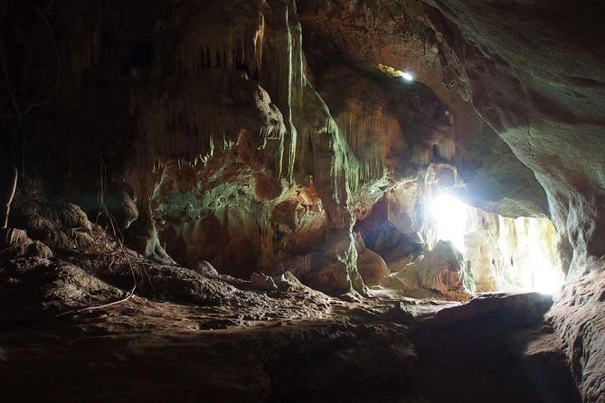 Luxury Small Group Phang Nga Bay and Beyond - Swimming through the sea cave at Kadu Island