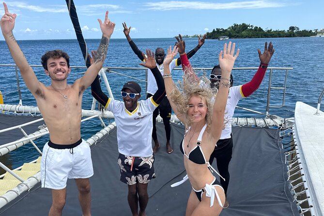 NEGRIL CATAMARAN CRUISE Sunset Ricks Cafe Adults only ALL HOTELS - Walking through the sea to board