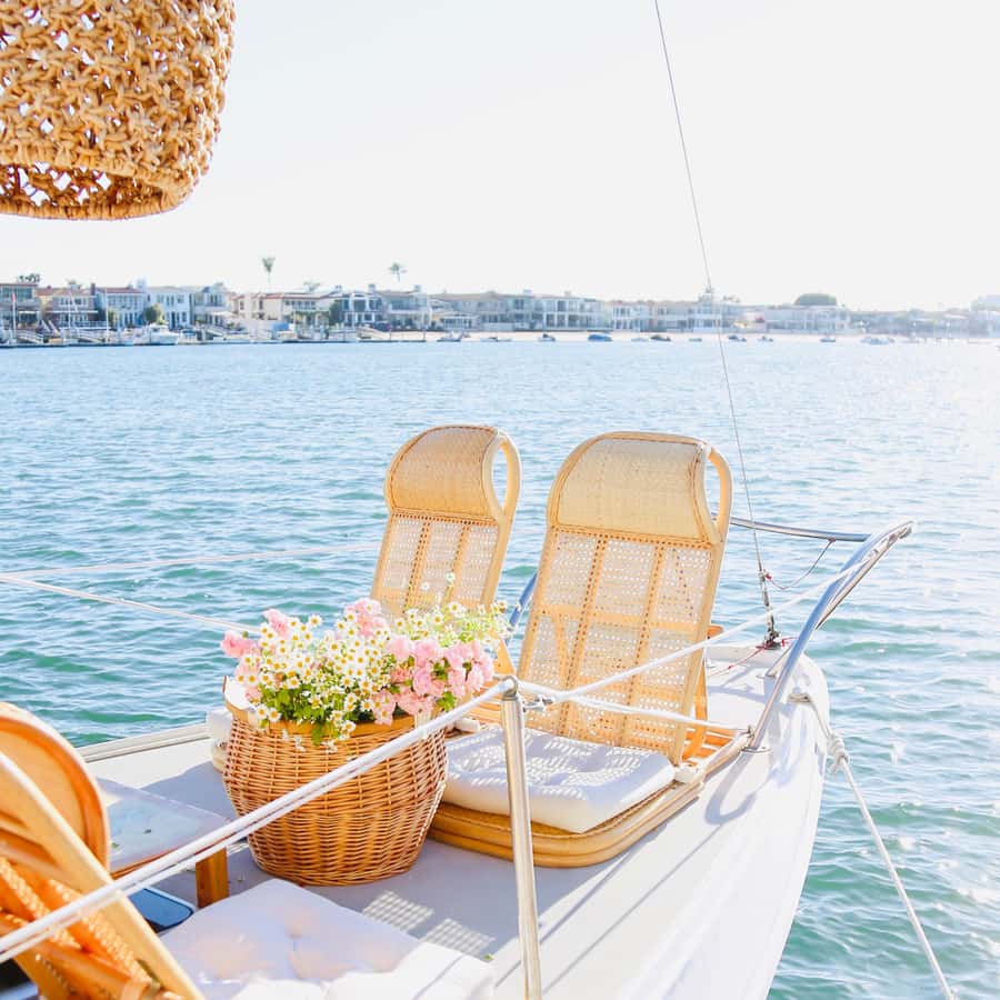 Newport Beach: The Boat People Cruise-Private Harbor Cruises - A small sailboat and a private view of Newport Beach