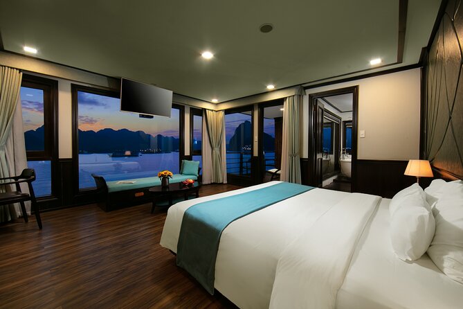 Peony Cruise 5<em> Halong Bay 3 days 2 nights with 2 ways transfer – Key points to know before you book’ /></p>
<ul>
<li><strong>Two nights on the bay:</strong> The longer stay gives you more time on the water than a one-night cruise.</li>
<li><strong>Private balcony in every cabin:</strong> You can watch the scenery without relying on the shared sun deck.</li>
<li><strong>Sunrise Tai Chi at 6:00 or 6:15:</strong> The early start is worth considering if you want the quietest views.</li>
<li><strong>Less touristy sailing route:</strong> Peony aims to get away from the busiest parts of Halong Bay.</li>
<li><strong>Meals included:</strong> The package covers two breakfasts, two dinners, and three lunches.</li>
<li><strong>A smooth operation matters:</strong> The available rating is 4.8 from 37 reviews, with 97 percent recommending the experience.</li>
</ul>
<h2>Why two nights changes the Halong Bay experience</h2>
<p><img width="669" height="446" decoding="async" src=