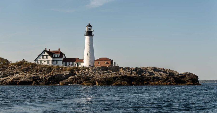 Portland: Sunset Lighthouse Cruise in Casco Bay with Drinks - Casco Bay at sunset, with Portland in view