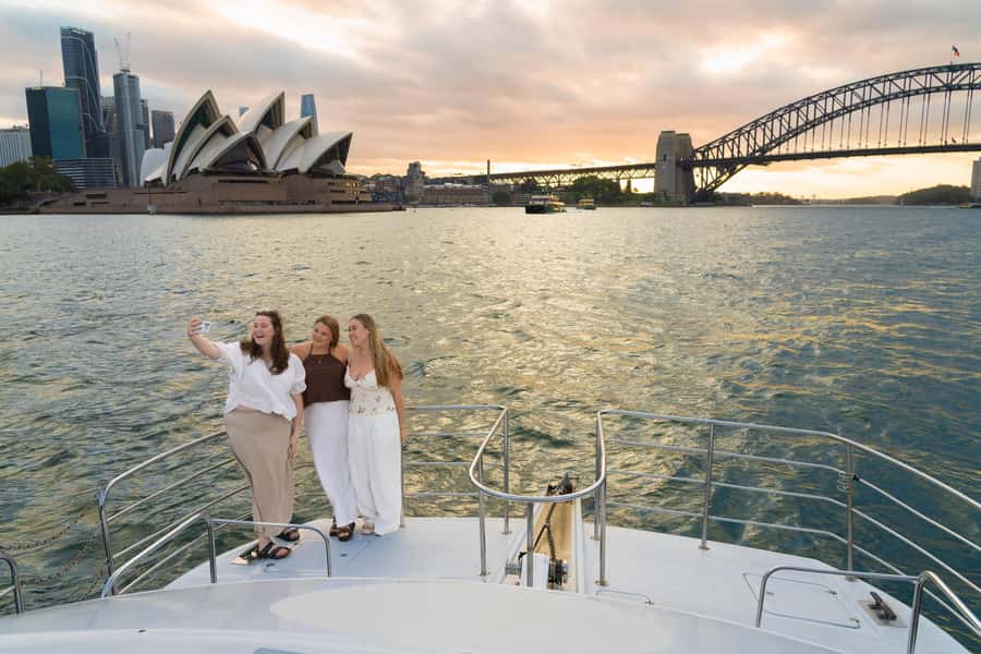 Sydney: Golden Glow Sunset Harbour Cruise with 1 Drink - The crew sets the tone